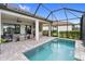 A screened-in pool and patio area provides a great outdoor living space, perfect for relaxing and entertaining with outdoor kitchen at 4735 Cassio Ct, Bradenton, FL 34211