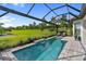 Private pool and patio area overlooking green space, offering a perfect outdoor retreat at 4735 Cassio Ct, Bradenton, FL 34211
