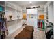 Spacious walk-in closet with custom shelving, drawers, and ample storage space at 4735 Cassio Ct, Bradenton, FL 34211