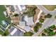 Aerial view showcases a backyard with a pool, dock, lush greenery, and waterfront access, perfect for leisure at 4819 Palmetto Point Dr, Palmetto, FL 34221
