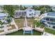 Charming backyard boasts a screened pool, boat dock, and picturesque waterfront access, ideal for relaxation at 4819 Palmetto Point Dr, Palmetto, FL 34221
