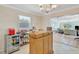 Entertaining area with a wood bar, mini-fridge, and ample shelving for displaying spirits and barware at 4819 Palmetto Point Dr, Palmetto, FL 34221