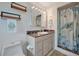 Bathroom featuring a marble countertop vanity, toilet, and shower with a unique marine life-themed curtain at 4819 Palmetto Point Dr, Palmetto, FL 34221