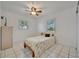 Bright bedroom with a comfy bed, ceiling fan, and plantation shutters allowing natural light to filter in at 4819 Palmetto Point Dr, Palmetto, FL 34221