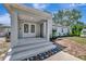 Welcoming front porch with double doors and elegant landscaping, promising a comfortable and stylish home entry at 4819 Palmetto Point Dr, Palmetto, FL 34221