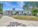 Charming single-story home with a well-manicured lawn and a spacious driveway, perfect for suburban living at 4819 Palmetto Point Dr, Palmetto, FL 34221