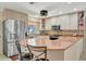 Kitchen featuring stainless steel appliances, granite countertops, and light wood cabinets at 4819 Palmetto Point Dr, Palmetto, FL 34221
