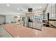 Spacious kitchen with stainless steel appliances, light wood cabinets, and an eat-in counter at 4819 Palmetto Point Dr, Palmetto, FL 34221