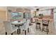 Bright kitchen with stainless steel appliances, breakfast bar, and adjacent dining area at 4819 Palmetto Point Dr, Palmetto, FL 34221