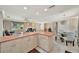 Bright, open-concept living space adjacent to kitchen, featuring modern tile floors, fireplace, and living area at 4819 Palmetto Point Dr, Palmetto, FL 34221