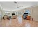 Spacious living room with tile floors, patio access and a dedicated office space at 4819 Palmetto Point Dr, Palmetto, FL 34221