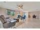 Spacious living room with comfortable seating, tile floors, fireplace, and bright natural light at 4819 Palmetto Point Dr, Palmetto, FL 34221
