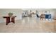Open floor plan showcasing the living area connected to the kitchen and dining space with tile flooring at 4819 Palmetto Point Dr, Palmetto, FL 34221