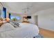 Bright main bedroom with hardwood floors, a king bed, and natural light streaming through two windows at 4819 Palmetto Point Dr, Palmetto, FL 34221