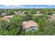 Aerial view of the house highlighting the pool, screened lanai, and mature landscaping at 5619 Oak Grove Ct, Sarasota, FL 34233