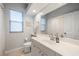 Bright bathroom featuring tile floors, a large mirror, and modern fixtures at 5619 Oak Grove Ct, Sarasota, FL 34233