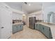 Beautiful kitchen with a pantry, tiled backsplash, stainless steel appliances, and views of the dining room at 5619 Oak Grove Ct, Sarasota, FL 34233