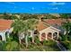 Beautiful aerial view of a well-maintained home with a tile roof in a desirable community at 5662 Fossano Dr, Sarasota, FL 34238