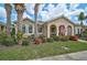 Charming single-story home with lush landscaping and inviting curb appeal at 5662 Fossano Dr, Sarasota, FL 34238