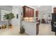 Open kitchen showcasing wood cabinets and a breakfast nook at 5662 Fossano Dr, Sarasota, FL 34238