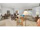 Bright and spacious living room featuring neutral tones and ample seating at 5662 Fossano Dr, Sarasota, FL 34238