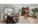 Comfortable living room with a large sectional sofa and access to the outdoor patio at 5662 Fossano Dr, Sarasota, FL 34238