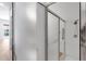 Walk-in shower with glass door and handicap bars for safety and convenience at 5779 Wilena Pl, Sarasota, FL 34238