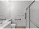 Bathroom featuring a shower with glass doors and a sink with a vanity at 5779 Wilena Pl, Sarasota, FL 34238