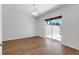 Bedroom with hardwood flooring and sliding glass door access to the lanai at 5779 Wilena Pl, Sarasota, FL 34238