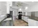Bright kitchen with white cabinets, stainless steel appliances, and granite countertops, perfect for cooking and entertaining at 5779 Wilena Pl, Sarasota, FL 34238