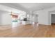 Spacious open-concept living area with abundant natural light and wood flooring at 5779 Wilena Pl, Sarasota, FL 34238
