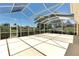 Spacious screened patio providing an excellent outdoor living area with scenic views of the neighborhood at 5779 Wilena Pl, Sarasota, FL 34238