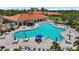 Resort-style pool with sun loungers and tables offering a relaxing and luxurious outdoor experience at 5779 Wilena Pl, Sarasota, FL 34238