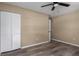 Bedroom features updated flooring and closet with sliding doors at 616 59Th Nw St, Bradenton, FL 34209