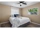 Bedroom with hardwood floors, neutral paint, and bright windows at 616 59Th Nw St, Bradenton, FL 34209