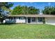 Charming single-story home featuring a well-manicured lawn, tidy landscaping and attached two-car garage at 616 59Th Nw St, Bradenton, FL 34209