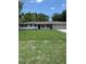 Charming single story home featuring a well-manicured lawn, attached two car garage and shuttered windows at 616 59Th Nw St, Bradenton, FL 34209