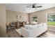 Bright living room features hardwood floors, a ceiling fan and neutral paint at 616 59Th Nw St, Bradenton, FL 34209