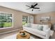 Comfortable living room with stylish decor, lots of natural light, and a modern ceiling fan at 616 59Th Nw St, Bradenton, FL 34209
