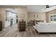 Open floor plan showcasing hardwood floors and seamless flow into the kitchen at 616 59Th Nw St, Bradenton, FL 34209