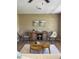 Stylized living room features hardwood floors, neutral paint and light colored modern furniture and decor at 616 59Th Nw St, Bradenton, FL 34209