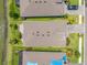 An overhead view of the house shows the layout, landscaping, and proximity to the water feature at 6550 Devesta Loop, Palmetto, FL 34221