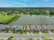 An aerial view highlighting the property's position in a waterside neighborhood, showcasing community layout and green spaces at 6550 Devesta Loop, Palmetto, FL 34221