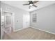 This bedroom has carpet flooring, a ceiling fan, and a large closet at 6550 Devesta Loop, Palmetto, FL 34221
