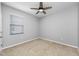 This is a simple bedroom with carpet flooring and a ceiling fan at 6550 Devesta Loop, Palmetto, FL 34221