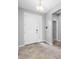 Welcoming entryway with tile flooring, a stylish front door, and neutral paint at 6550 Devesta Loop, Palmetto, FL 34221