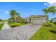 Charming single-story home with a neutral color scheme, an attached garage, and well-manicured landscaping at 6550 Devesta Loop, Palmetto, FL 34221