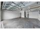 Spacious two-car garage with concrete flooring, high ceilings, and plenty of room for parking at 6550 Devesta Loop, Palmetto, FL 34221