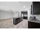 Open-concept kitchen with an island, stainless steel appliances, and granite countertops is perfect for entertaining at 6550 Devesta Loop, Palmetto, FL 34221