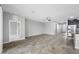 The living room has tile flooring and a ceiling fan at 6550 Devesta Loop, Palmetto, FL 34221